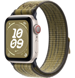 Apple Watch SE // 44мм GPS+Cellular // Корпус из алюминия цвета «сияющая звезда», спортивный браслет Nike цвета «Зеленый/серый» (2024)